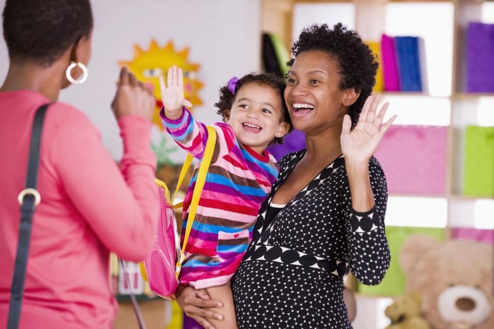child waving good-bye to parent